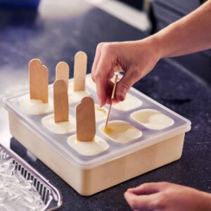 the process of assembling and freezing Eskimo Pie popsicles