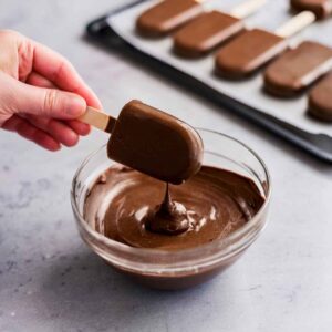 the dipping process for homemade Eskimo Pie popsicles